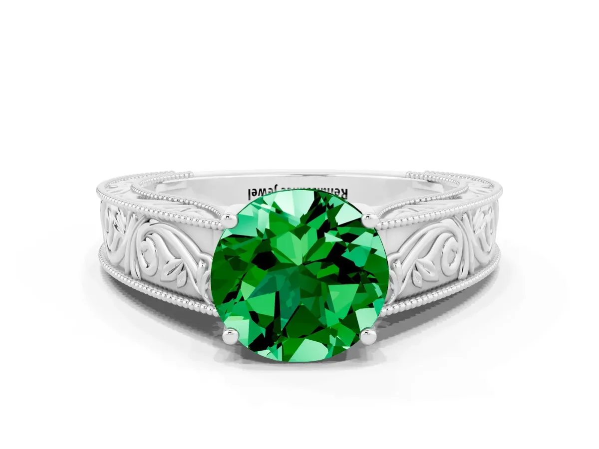 Round Cut Emerald Solitaire Ring with Engraved Band and Four-Prong Setting White gold