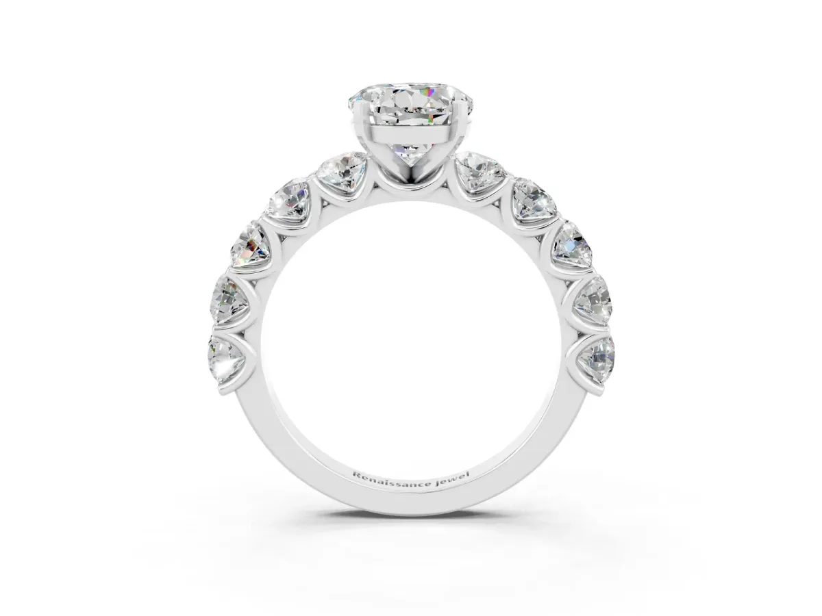 Round Cut Moissanite Prong Setting with Side Stones on a Pave Band Silver
