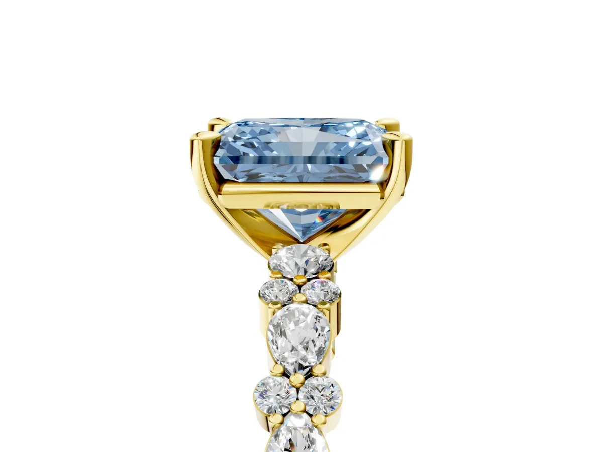 Fancy Blue Radiant Cut Diamond Side Stone Solitaire Ring with Round and Four-Prong Setting Yellow gold