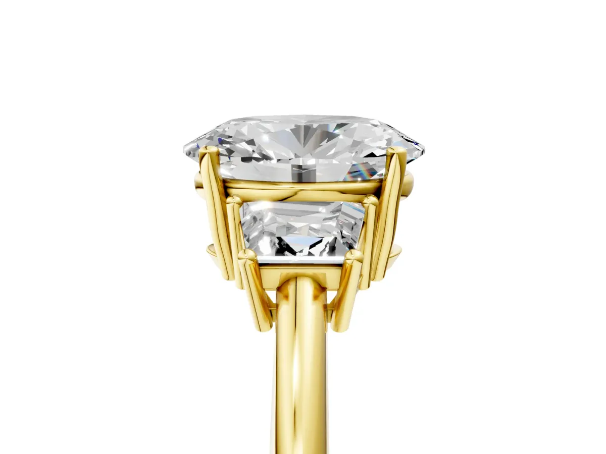 Oval Cut Diamond Three-Stone Ring with Trapezoid Side Stones and Prong Setting Yellow gold