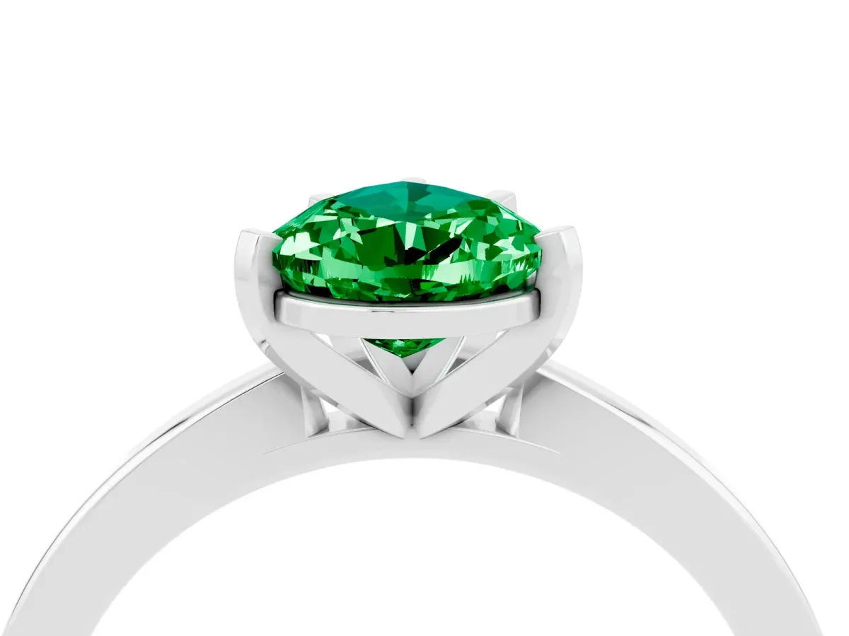 Pear Cut Emerald Solitaire Engagement Ring with Classic Band and Four-Prong Setting Silver
