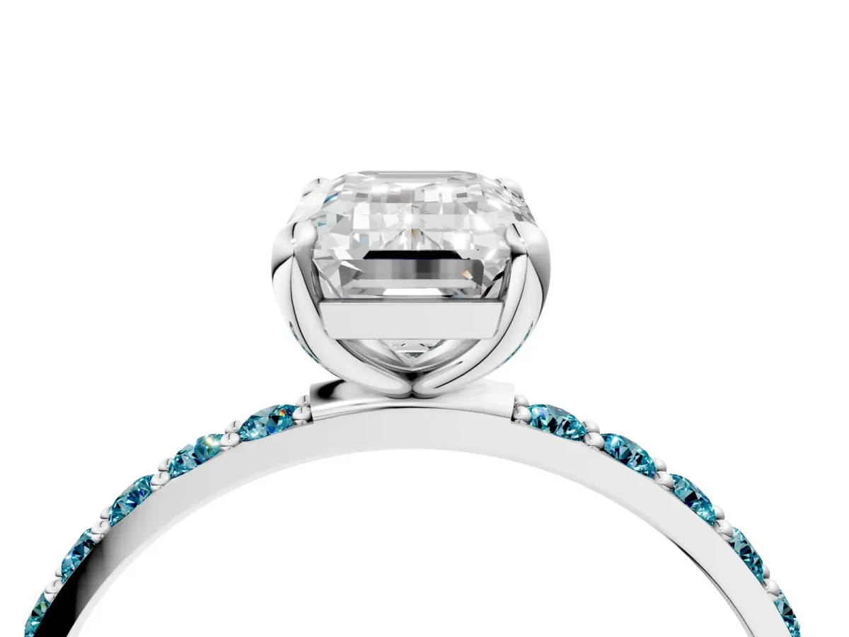 Emerald Cut Diamond Solitaire Ring with Round Blue Topaz Pavé Band and Prong Setting Silver