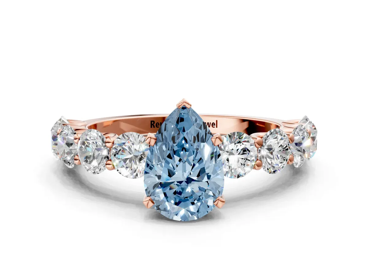 Fancy Blue Pear Cut Diamond Prong Setting with Side Stones on a Pave Band Rose gold