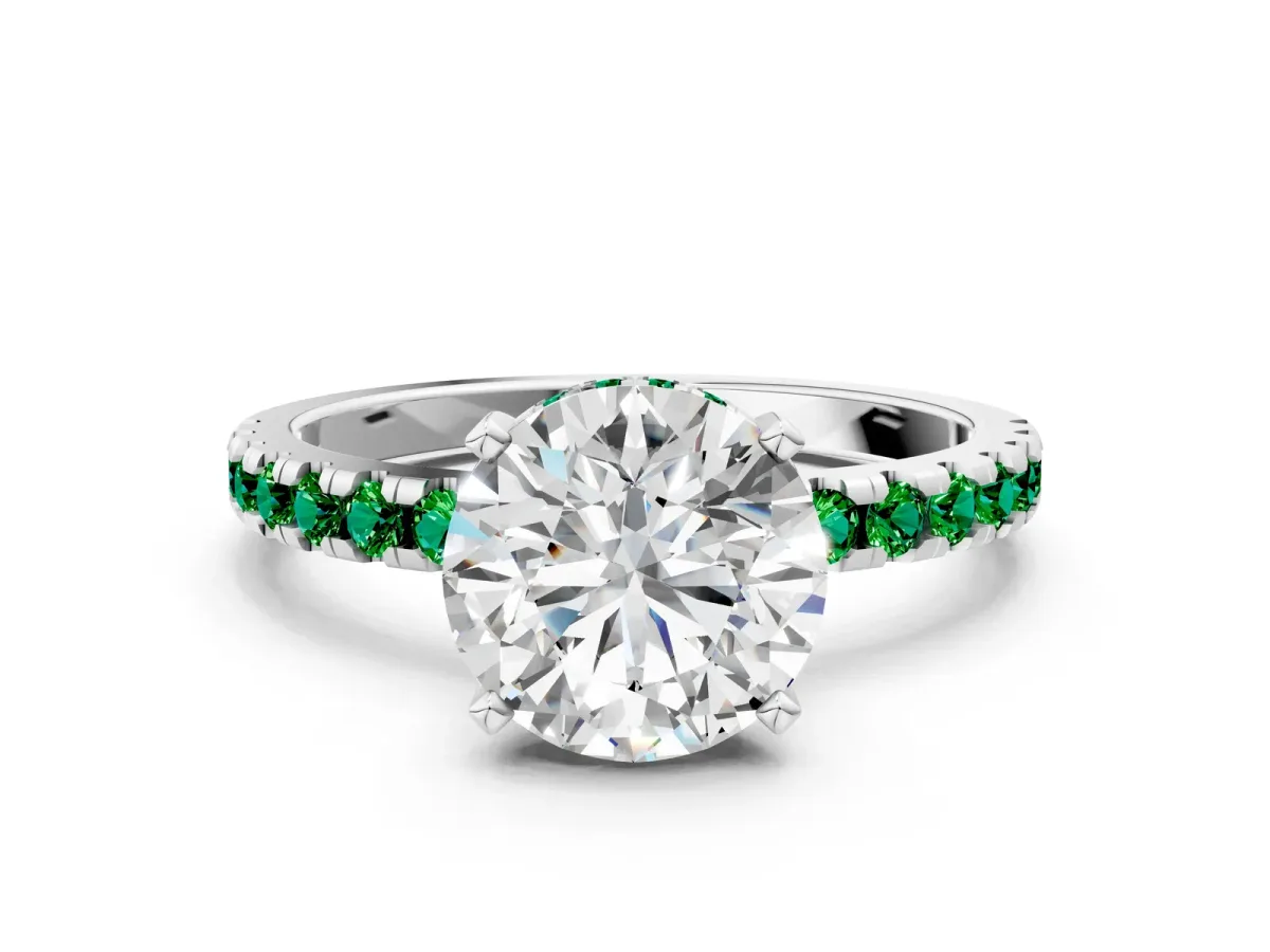 Round Cut Diamond Solitaire Ring with Round Emerald Pavé Band and Four-Prong Setting Silver