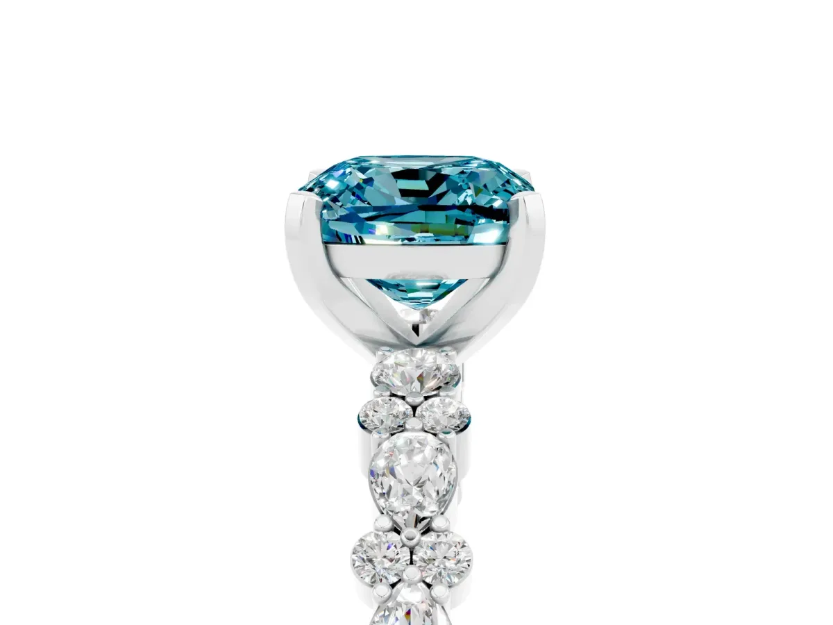 Cushion Cut Blue Topaz Side Stone Solitaire Ring with Round and Four-Prong Setting Platinum