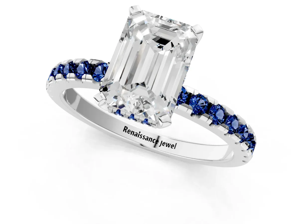 Emerald Cut Diamond Solitaire Ring with Round Blue Sapphire Pavé Band and Four-Prong Setting Silver