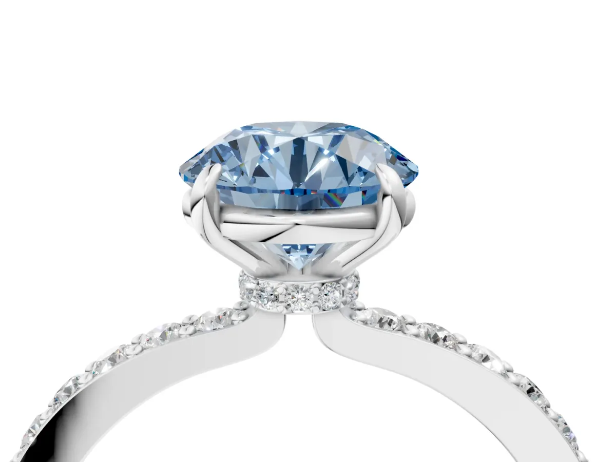 Fancy Blue Round Cut Diamond Solitaire Engagement Ring with Pavé Band and Four-Prong Setting Silver