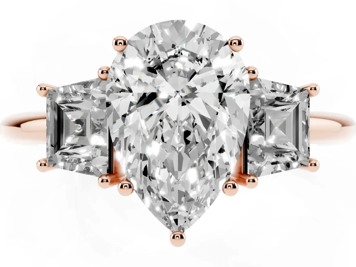 Pear Cut Diamond Three-Stone Ring with Trapezoid Side Stones and Prong Setting Rose gold