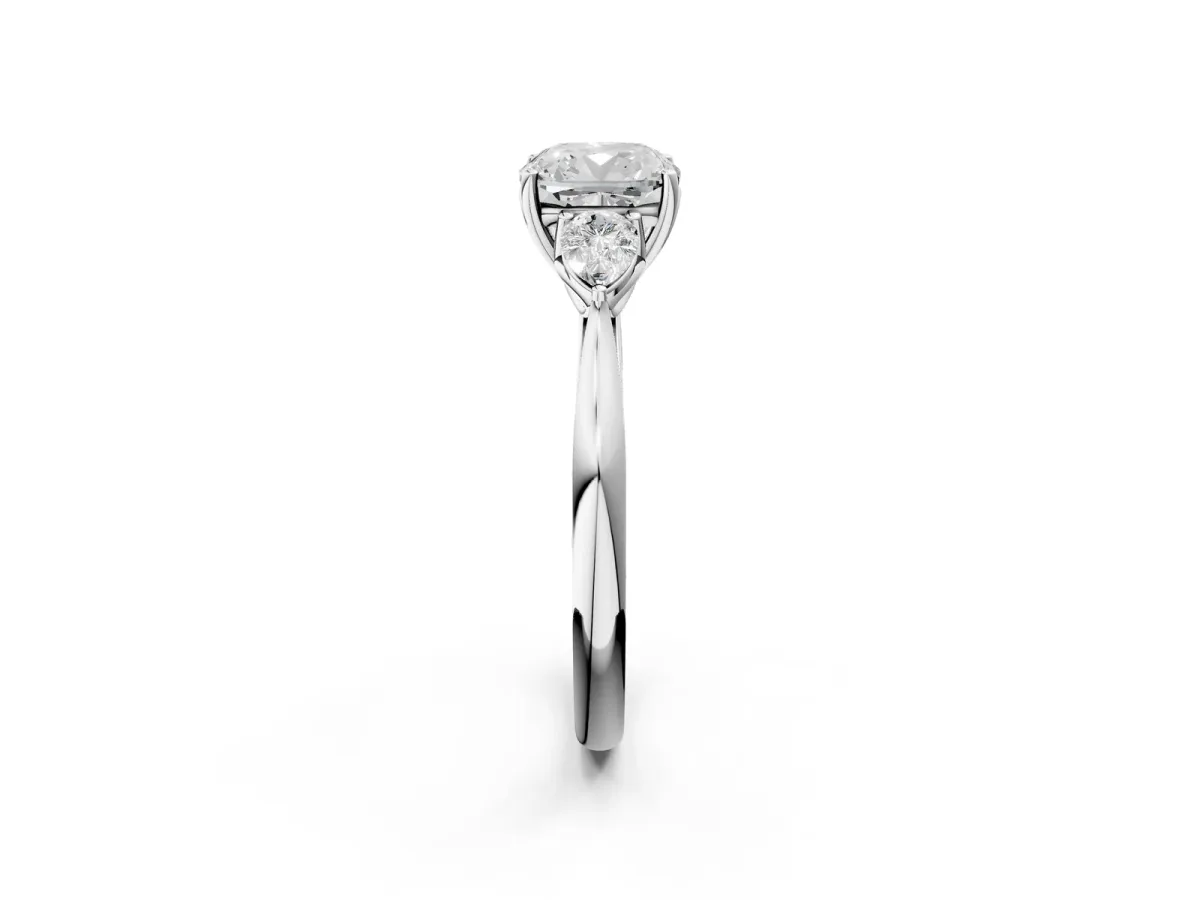 Three-Stone Cushion Cut Diamond Ring with Pear Side Stones in Four-Prong Setting White gold
