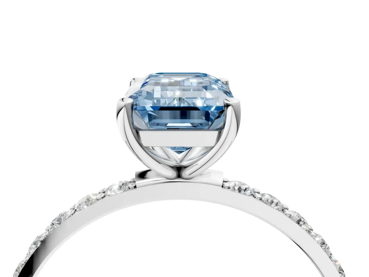 Fancy Blue Emerald Cut Diamond Solitaire Ring with Round Pavé Shoulders and Prong Setting Silver