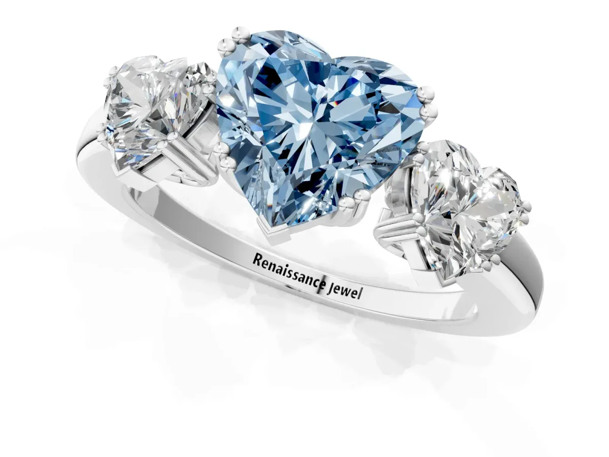 Fancy Blue Three-Stone Heart Cut Cut Diamond Ring with Channel Set Band and Four-Prong Setting Silver