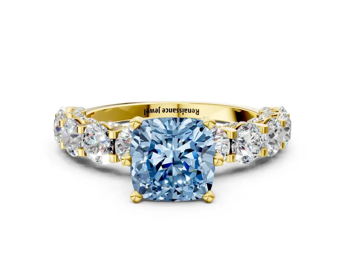 Fancy Blue Cushion Cut Diamond Side Stone Engagement Ring with Four-Prong Setting Yellow gold