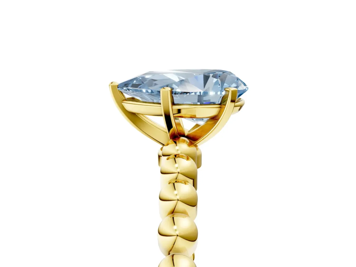 Fancy Blue Pear Cut Diamond Solitaire Ring with Beaded Band and Prong Setting Yellow gold