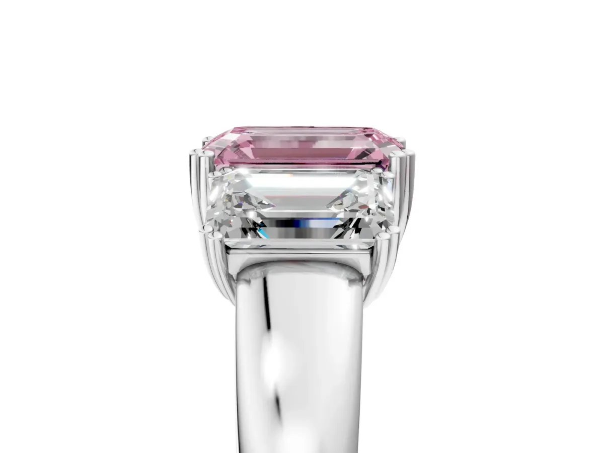 Fancy Pink Three-Stone Emerald Cut Cut Diamond Ring with Channel Set Band and Four-Prong Setting Silver