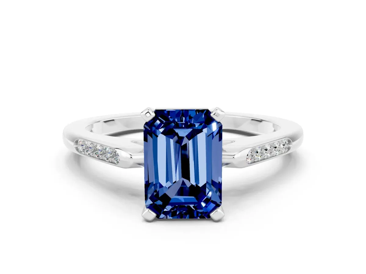 Emerald Cut Blue Sapphire Solitaire Ring with Channel Set Round Band and Prong Setting Silver
