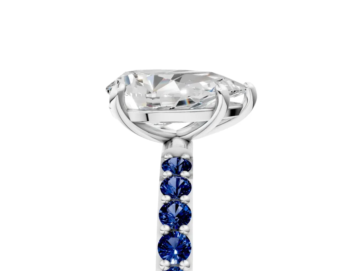 Pear Cut Diamond Solitaire Ring with Round Blue Sapphire Pavé Band and Prong Setting Silver