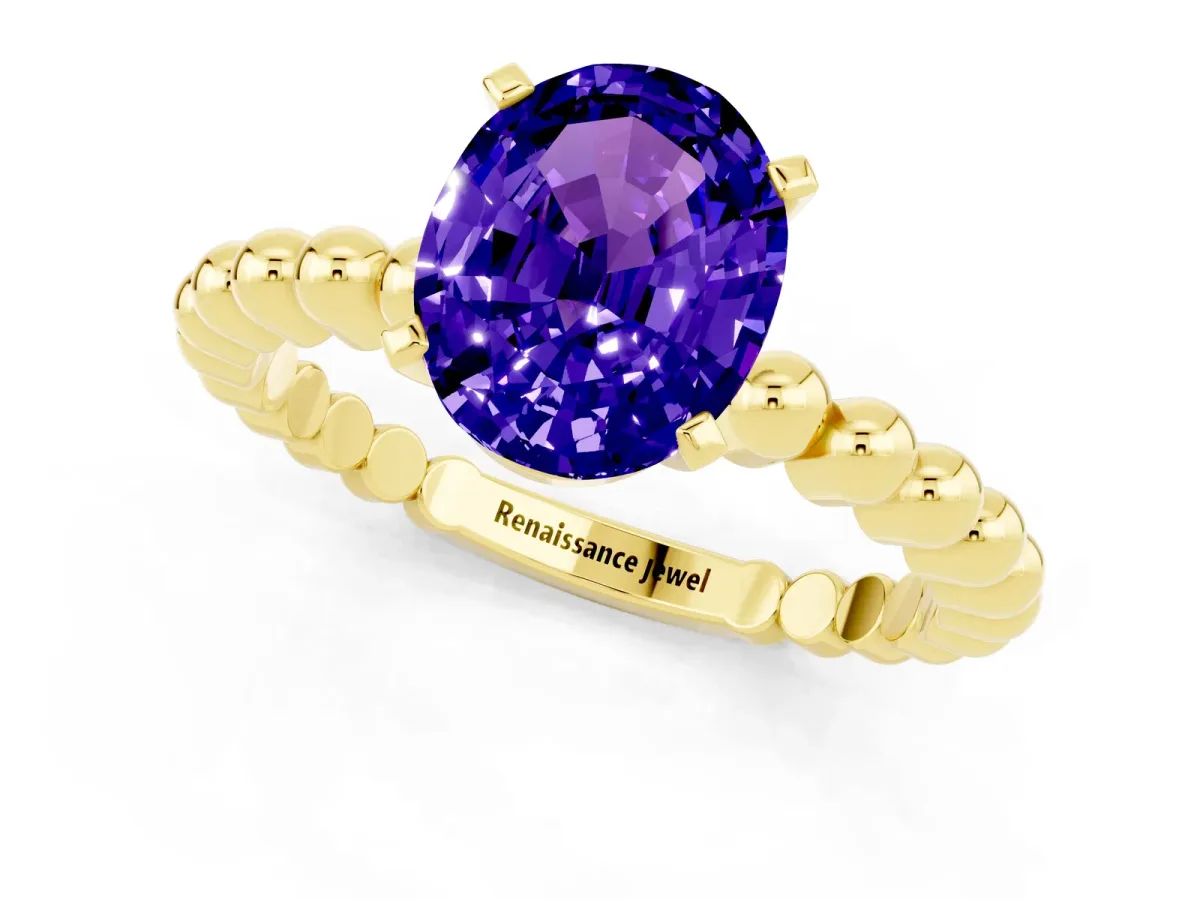 Oval Cut Tanzanite Solitaire Ring with Beaded Band and Prong Setting Yellow gold