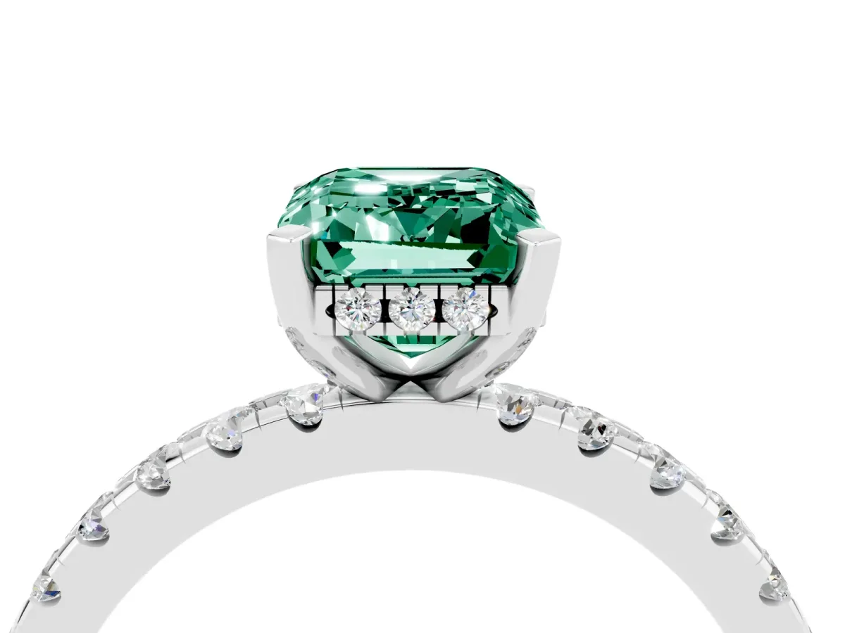 Emerald Cut Green Sapphire Solitaire Ring with Round Pavé Band and Four-Prong Setting Silver