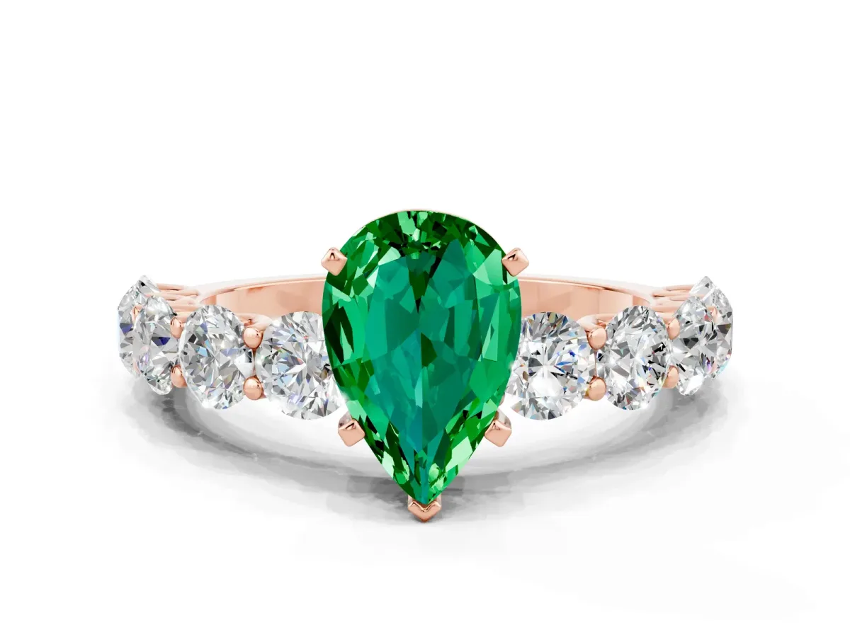 Pear Cut Emerald Prong Setting with Side Stones on a Pave Band Rose gold