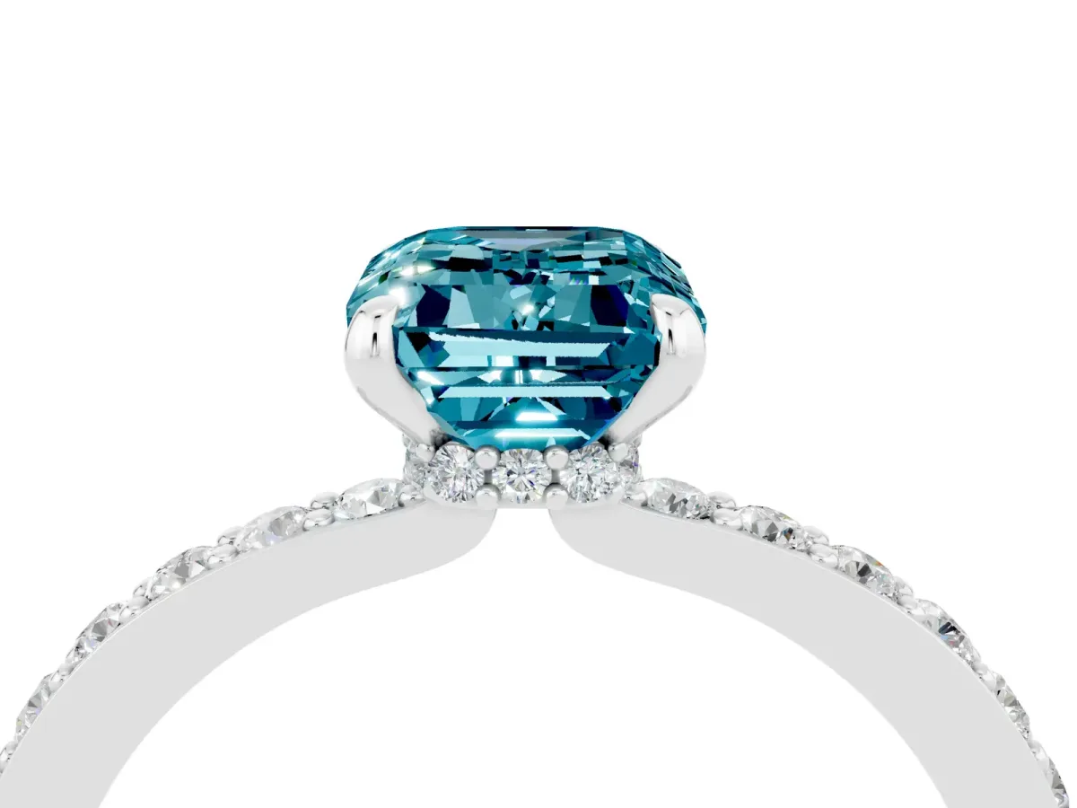Emerald Cut Blue Topaz Solitaire Engagement Ring with Pavé Band and Four-Prong Setting Silver
