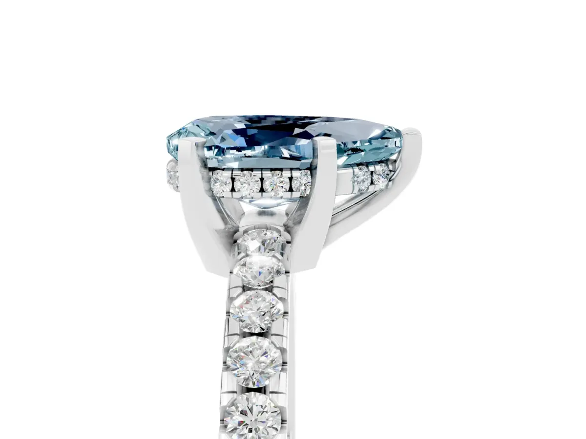 Pear Cut Aquamarine Solitaire Ring with Round Pavé Band and Four-Prong Setting Silver