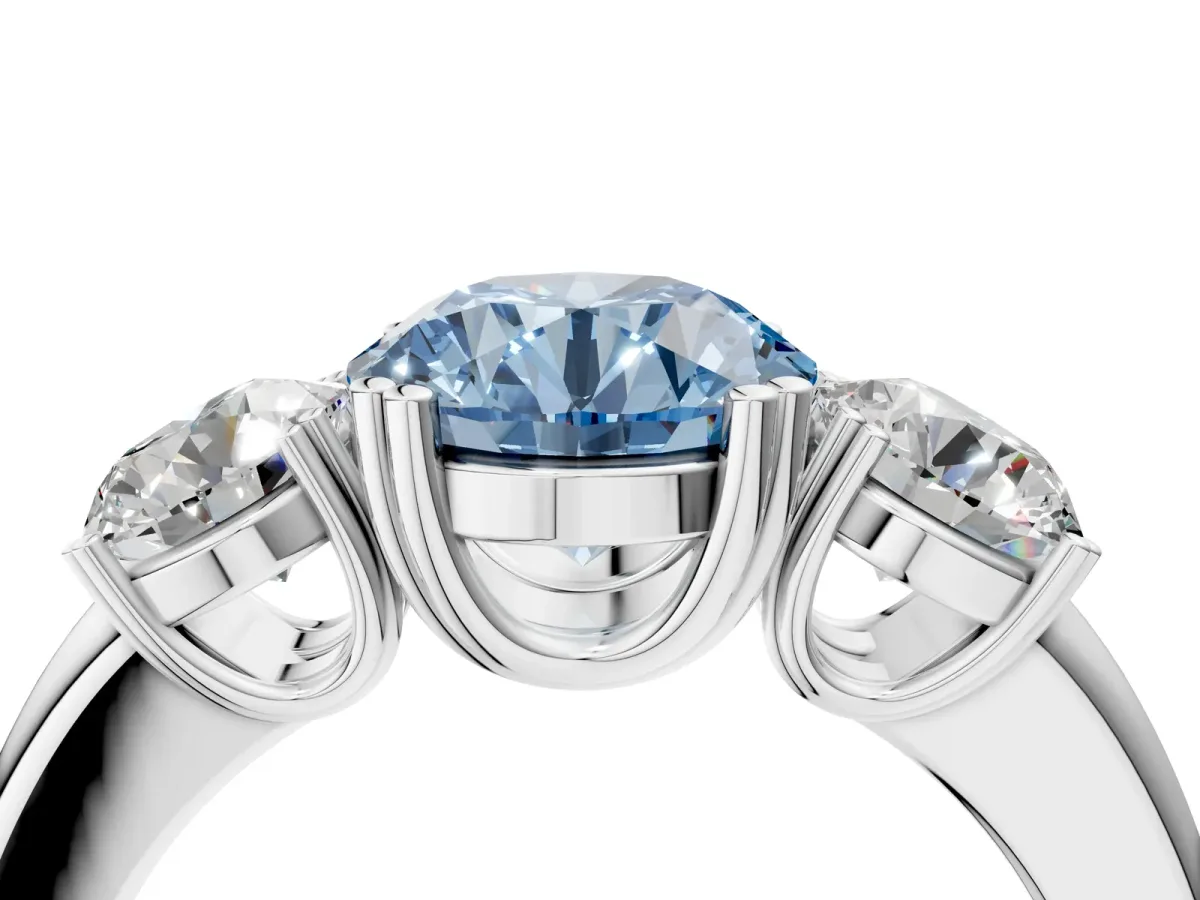 Fancy Blue Three-Stone Round Cut Cut Diamond Ring with Channel Set Band and Four-Prong Setting Silver