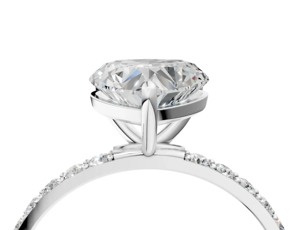 Heart Cut Diamond Solitaire Ring with Round Pavé Band and Prong Setting Silver
