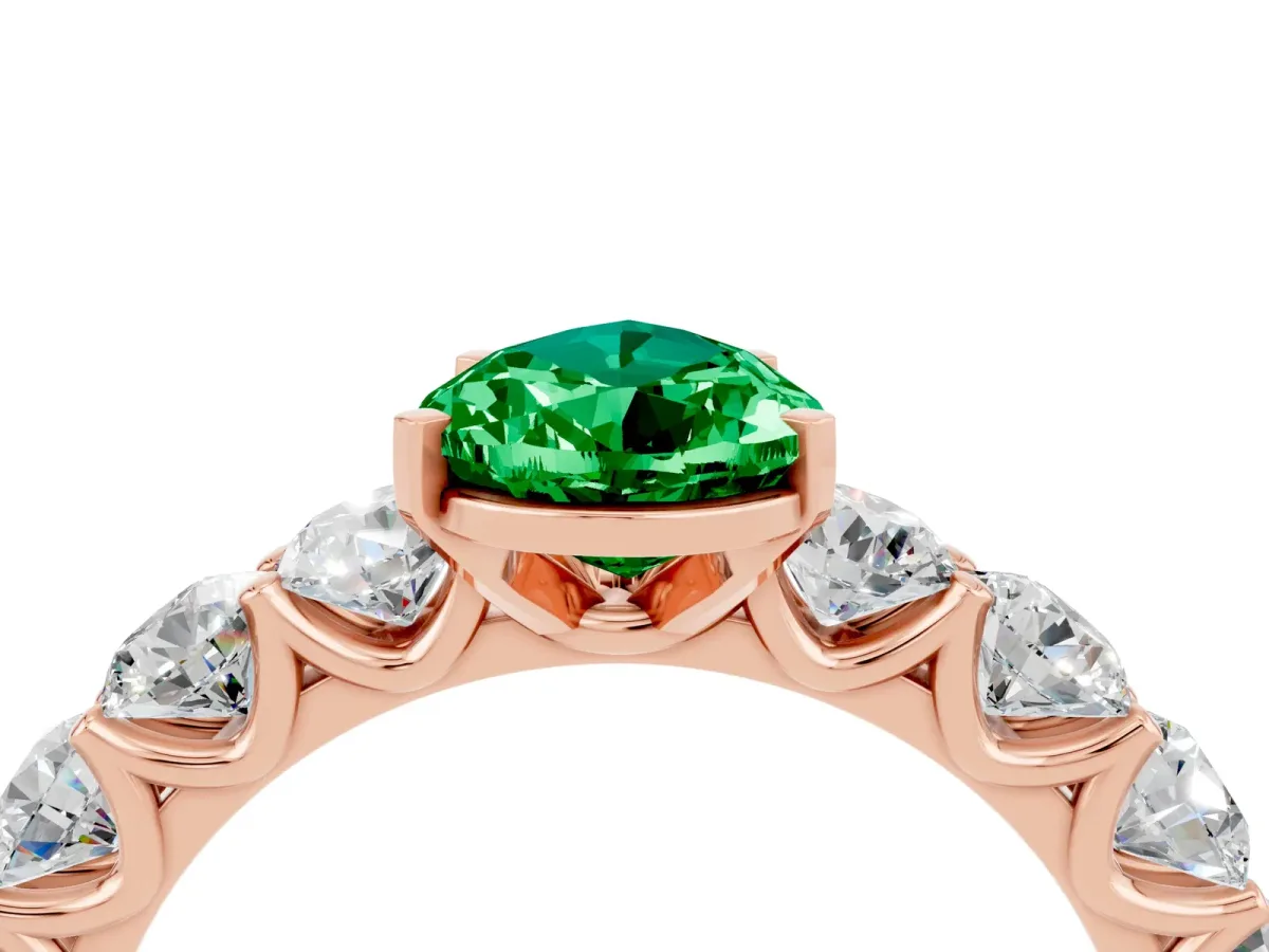 Pear Cut Emerald Prong Setting with Side Stones on a Pave Band Rose gold