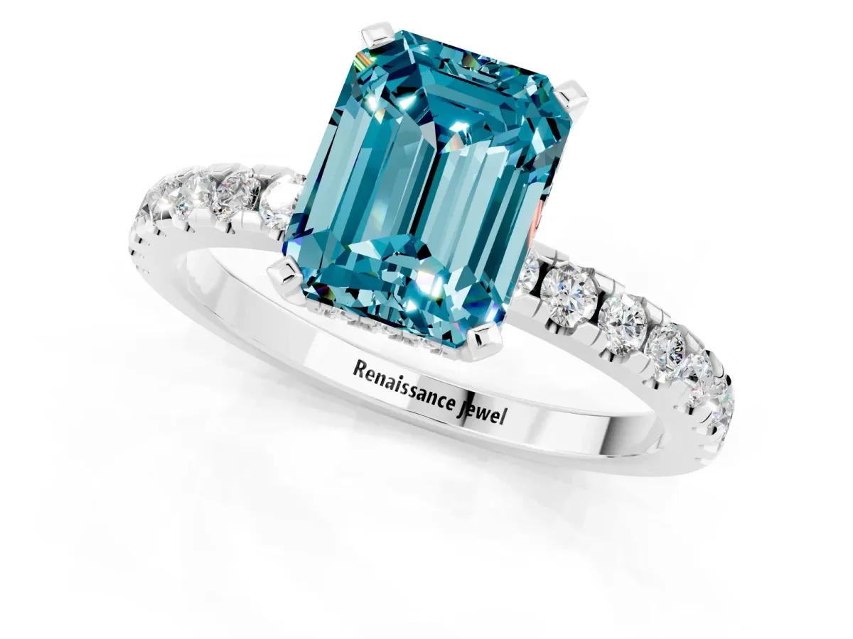 Emerald Cut Blue Topaz Solitaire Ring with Round Pavé Band and Four-Prong Setting Silver