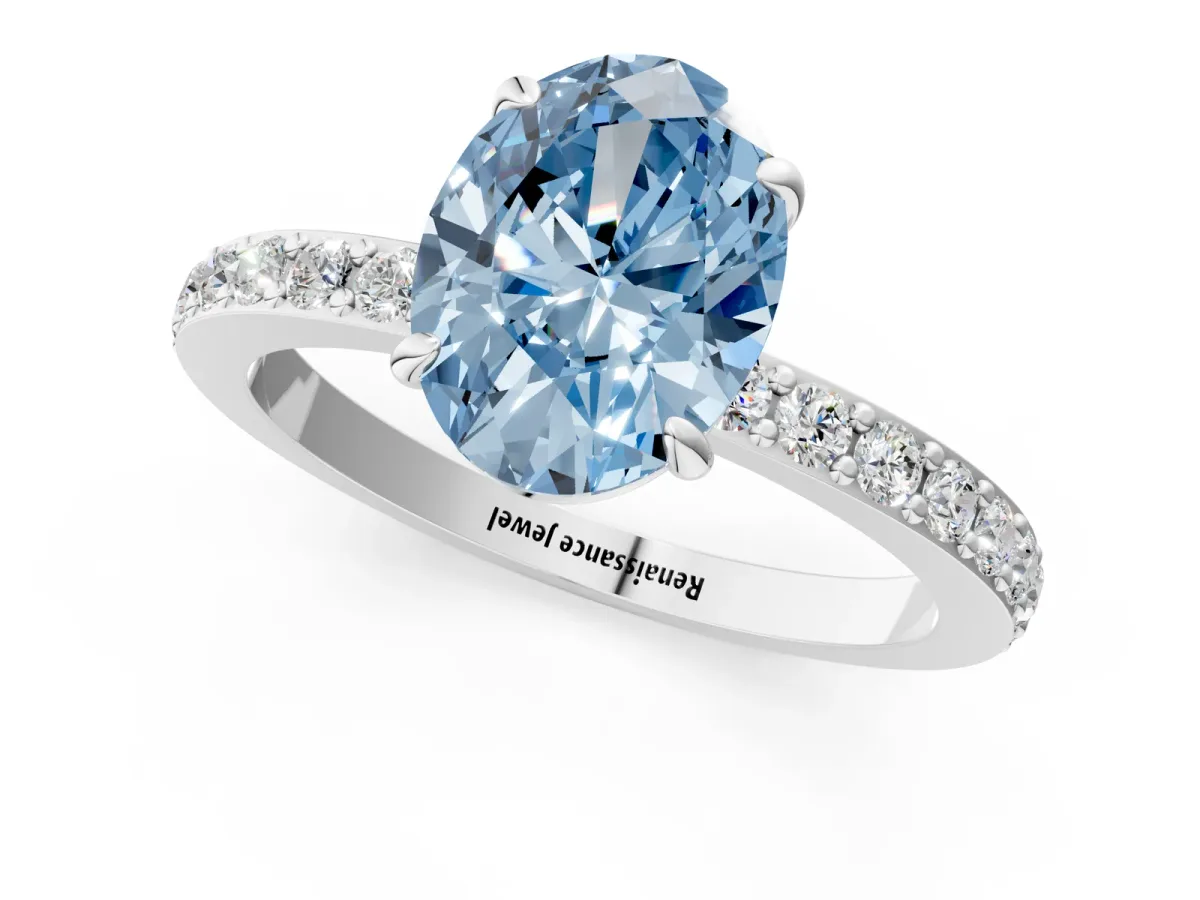 Fancy Blue Oval Cut Diamond Solitaire Engagement Ring with Pavé Band and Four-Prong Setting Silver