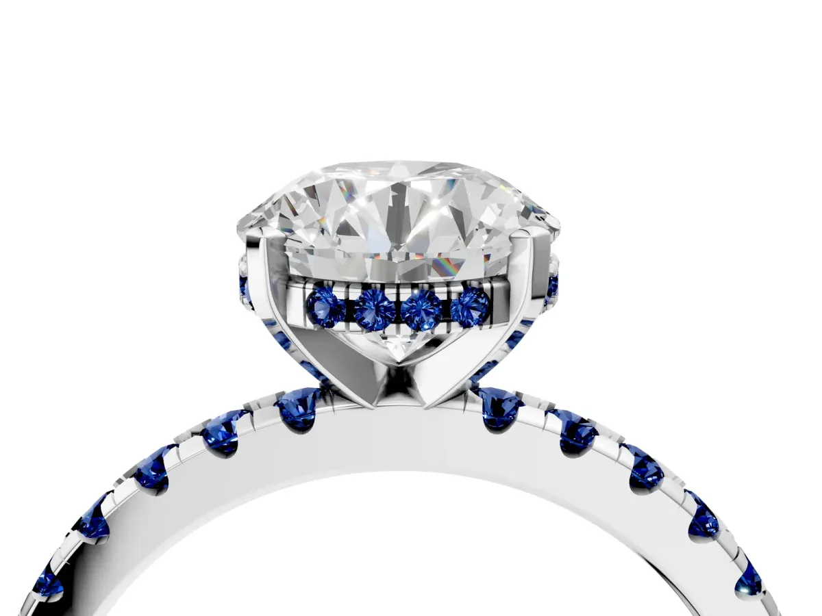 Round Cut Diamond Solitaire Ring with Round Blue Sapphire Pavé Band and Four-Prong Setting Silver