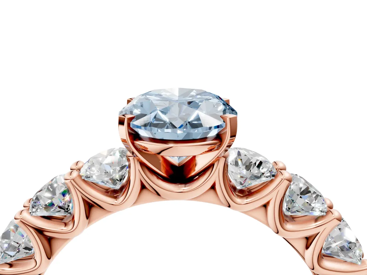 Fancy Blue Oval Cut Diamond Prong Setting with Side Stones on a Pave Band Rose gold