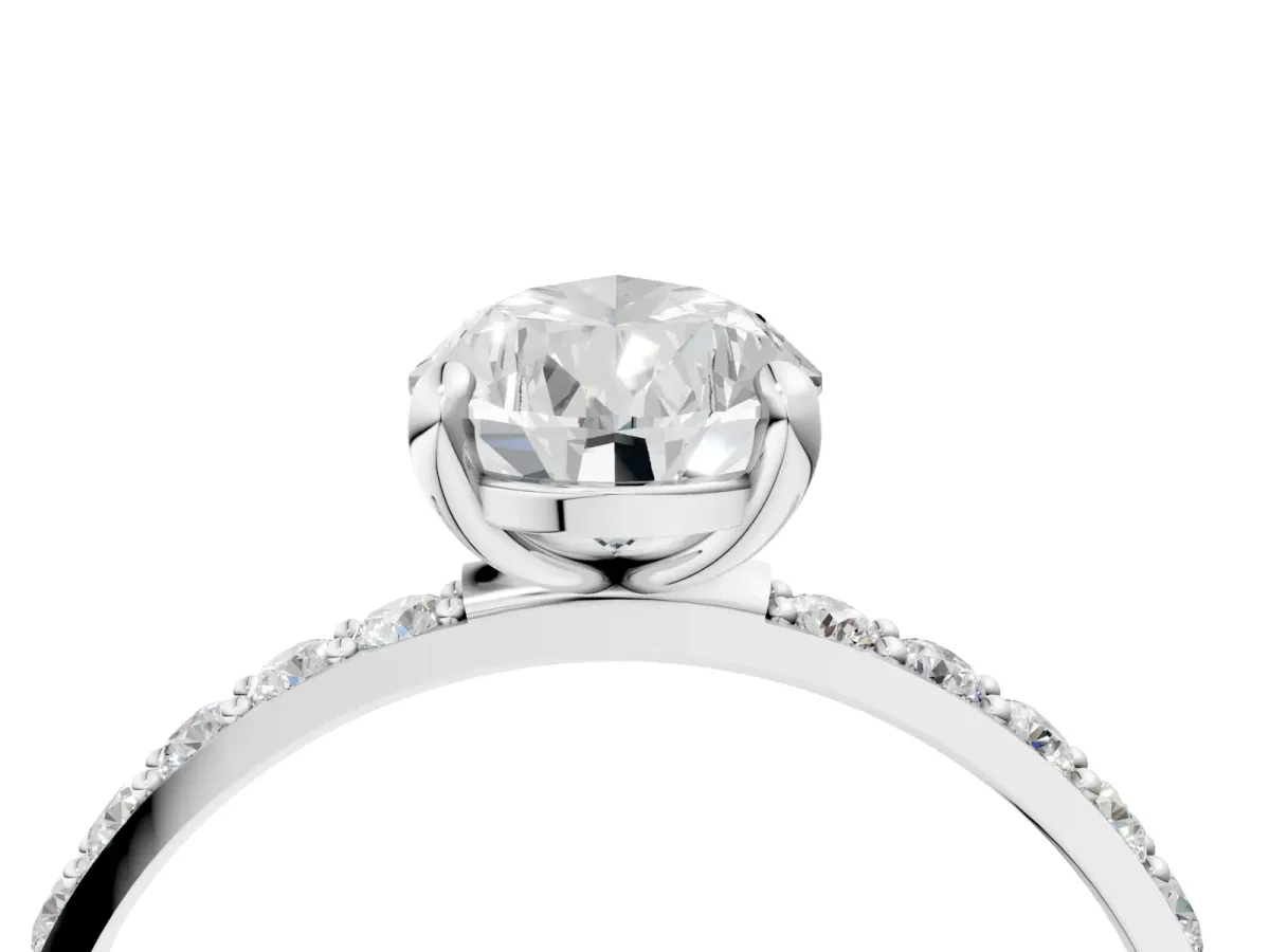 Pear Cut Diamond Solitaire Ring with Round Moissanite Pavé Band and Prong Setting Silver