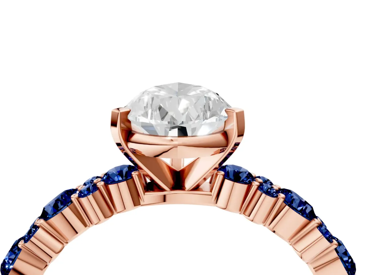 Pear Cut Diamond Side Stone Solitaire Ring with Round Blue Sapphire and Four-Prong Setting Rose gold