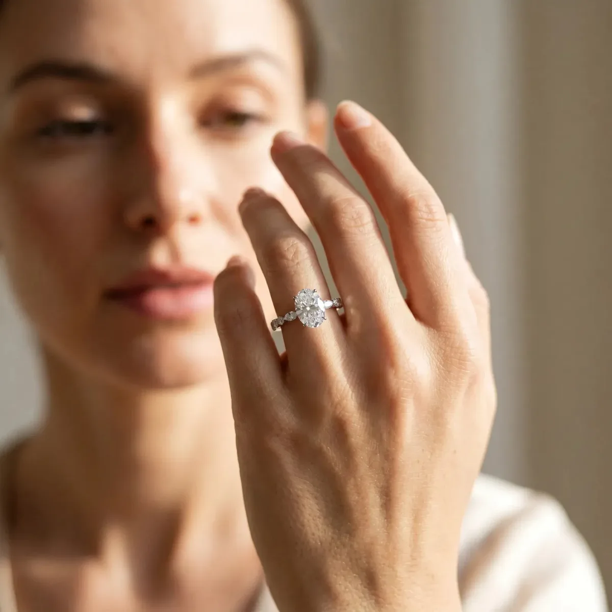 Oval Cut Diamond Ring with Marquise and Round Side Stones and Four-Prong Setting Silver