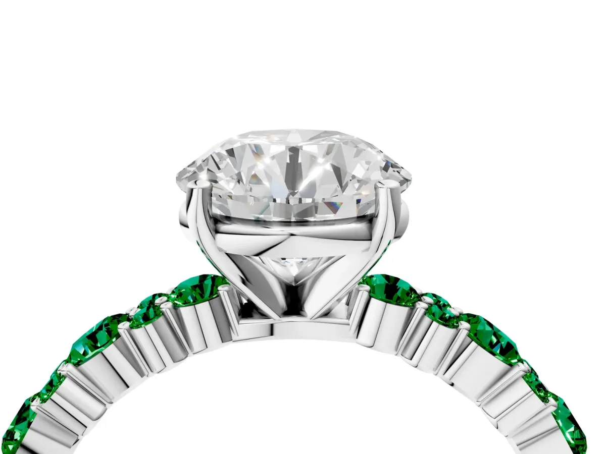 Round Cut Diamond Side Stone Solitaire Ring with Round Emerald and Four-Prong Setting White gold