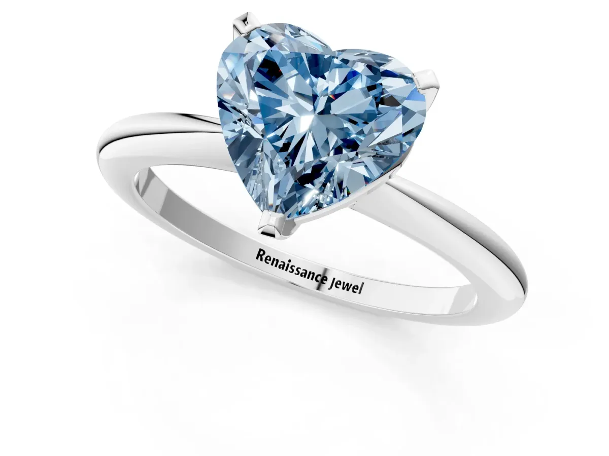 Fancy Blue Heart Cut Diamond Solitaire Ring with Six-Prong Setting and Classic Band Silver