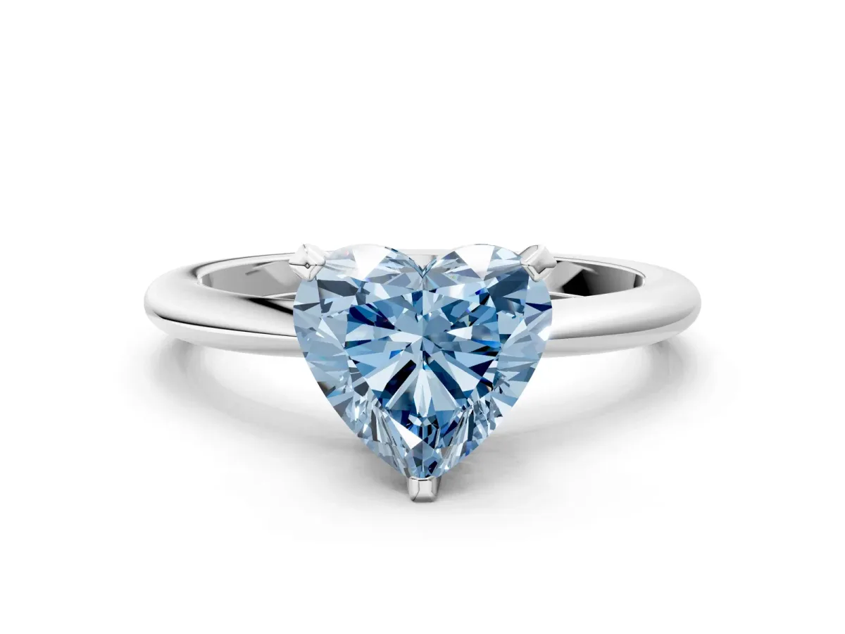 Fancy Blue Heart Cut Diamond Solitaire Ring with Six-Prong Setting and Classic Band Silver