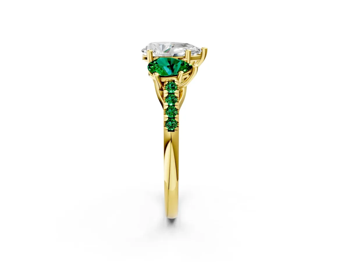 Three-Stone Pear Cut Diamond Ring with Round Emerald Pavé Band and Prong Setting Yellow gold