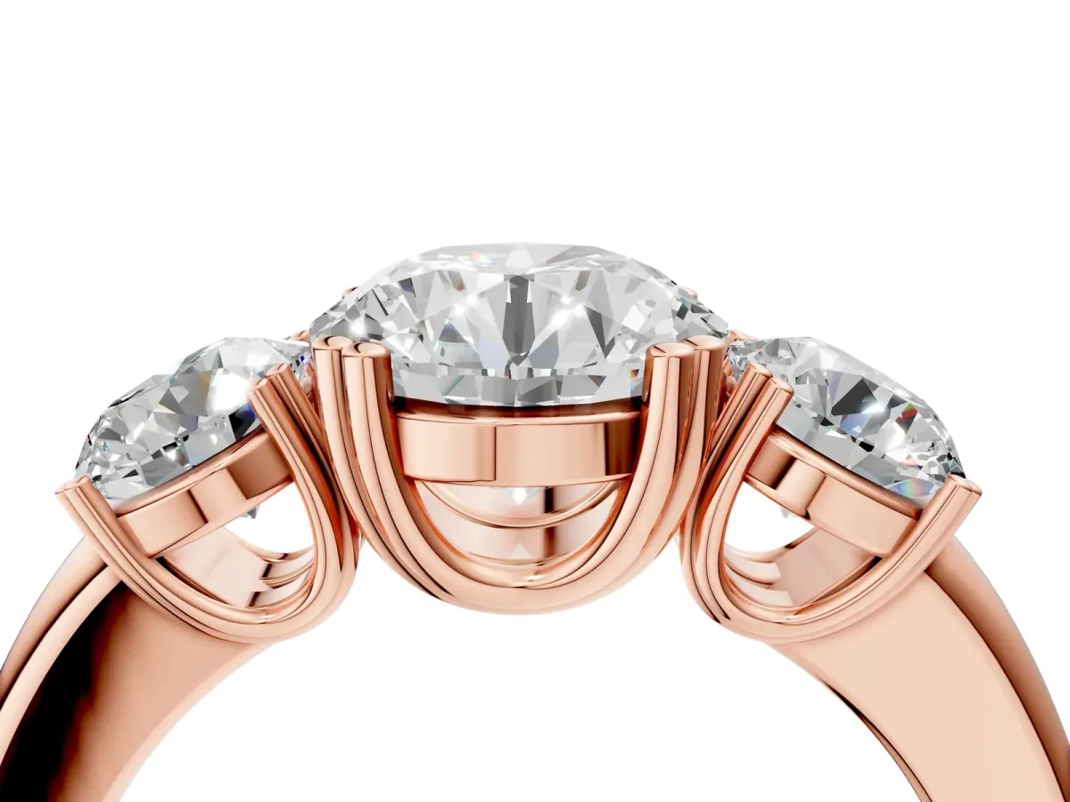 Three-Stone Round Cut Cut Diamond Ring with Channel Set Band and Four-Prong Setting Rose gold