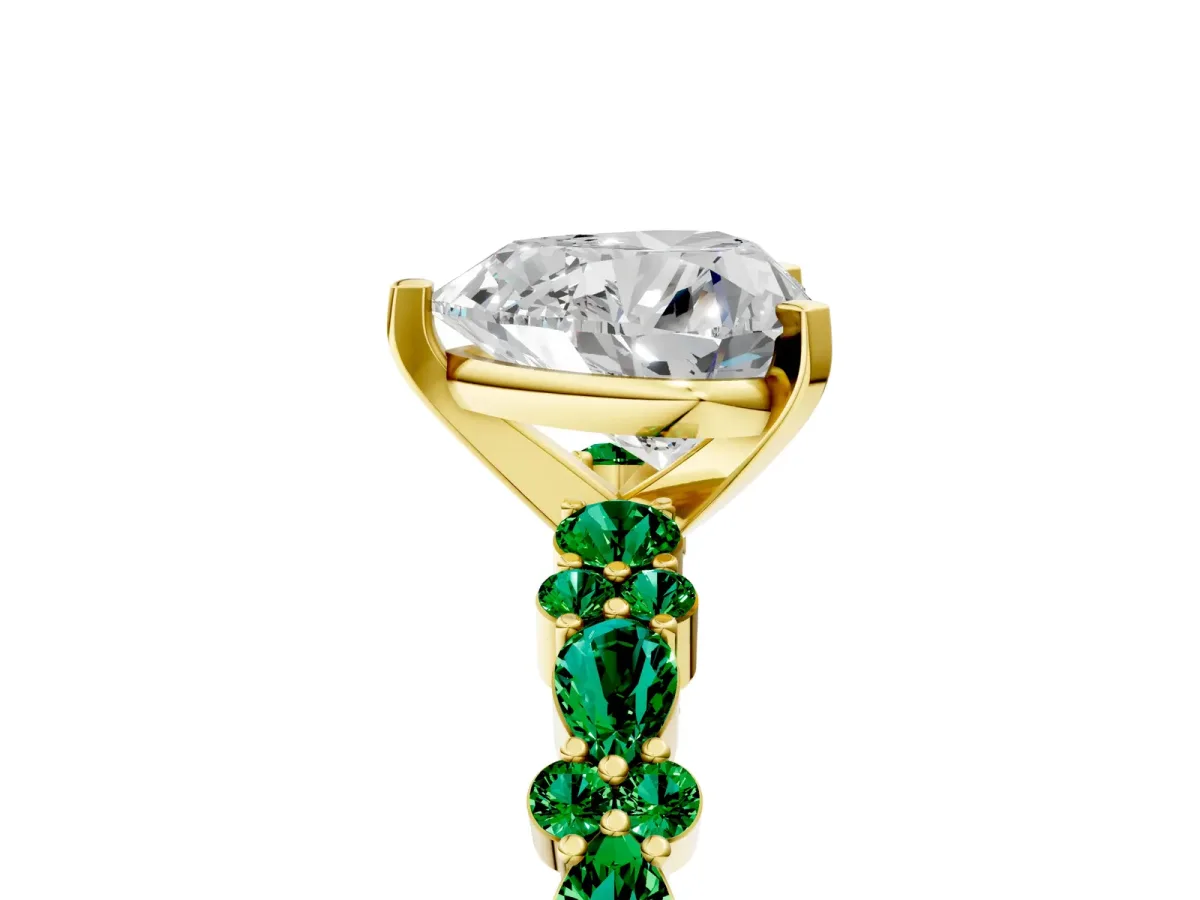 Heart Cut Diamond Side Stone Solitaire Ring with Round Emerald and Four-Prong Setting Yellow gold