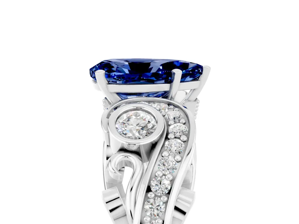 Pear Cut Blue Sapphire Solitaire Ring with Milgrain Pavé Band and Four-Prong Setting Silver