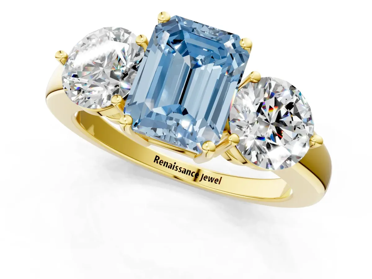Fancy Blue Emerald Cut Diamond Three-Stone Ring with Prong Setting and Classic Band Yellow gold