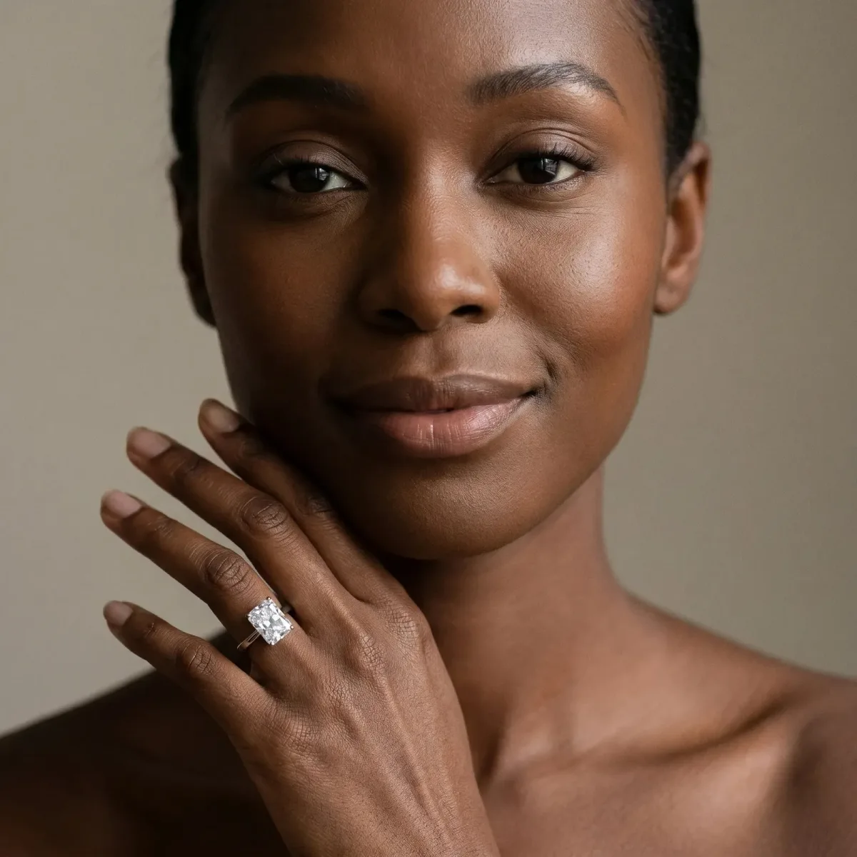 Radiant Cut Cut Solitaire Engagement Ring with Four-Prong Setting on a Classic Band Platinum
