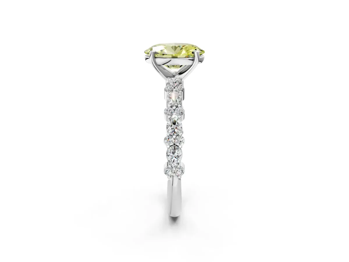 Fancy Yellow Oval Cut Diamond Side Stone Solitaire Ring with Round and Four-Prong Setting White gold