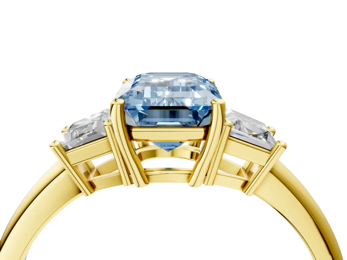 Fancy Blue Emerald Cut Diamond Three-Stone Ring with Trapezoid Side Stones and Prong Setting Yellow gold