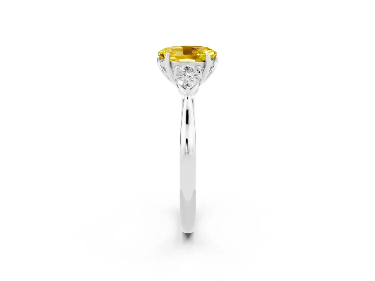 Three-Stone Oval Cut Yellow Sapphire Ring with Pear Side Stones in Four-Prong Setting White gold