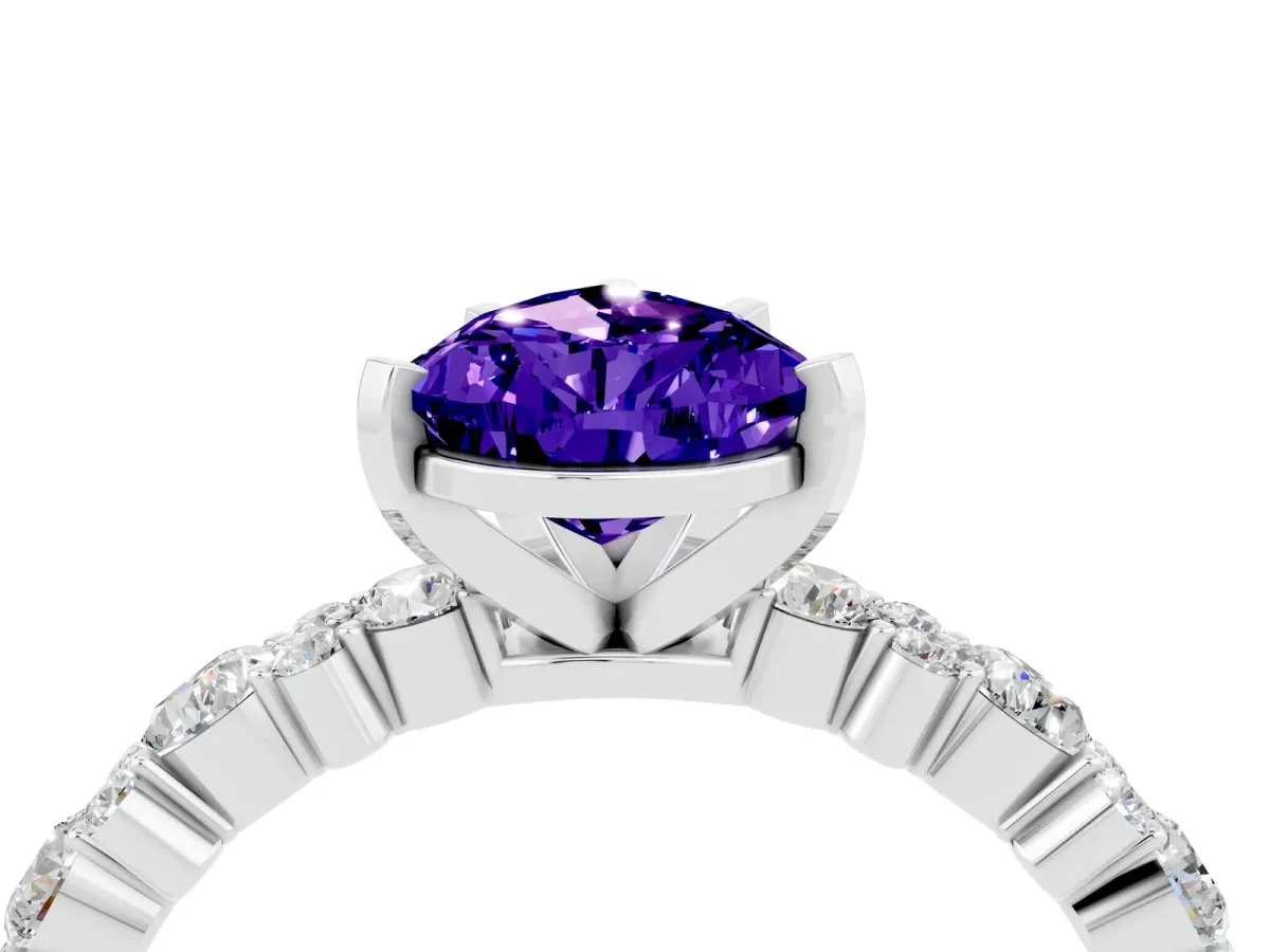 Pear Cut Tanzanite Side Stone Solitaire Ring with Round and Four-Prong Setting Silver