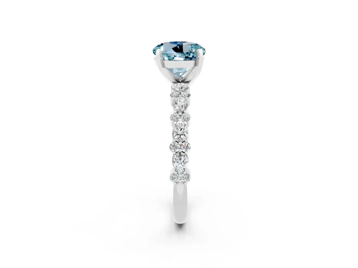 Round Cut Aquamarine Side Stone Solitaire Ring with Round and Four-Prong Setting Platinum