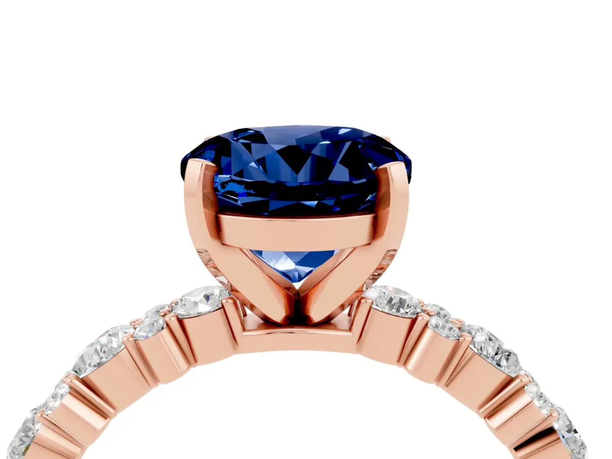 Round Cut Blue Sapphire Side Stone Solitaire Ring with Round and Four-Prong Setting Rose gold